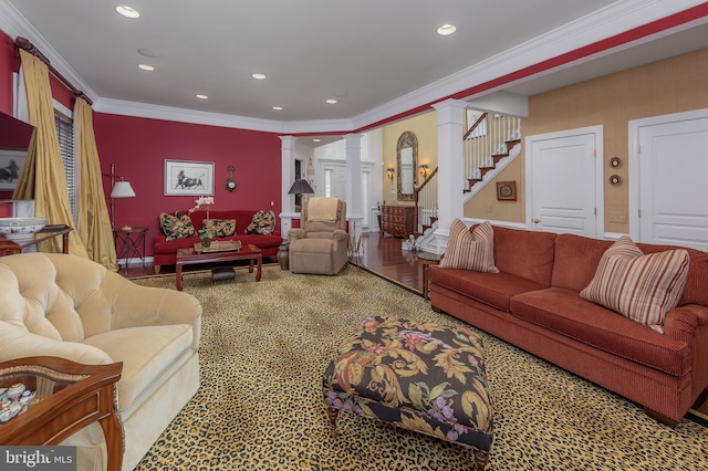 living room with ornamental molding, wood finished floors, stairs, ornate columns, and recessed lighting