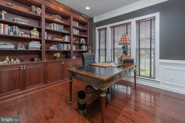 office space with a decorative wall, dark wood-style flooring, built in features, ornamental molding, and wainscoting