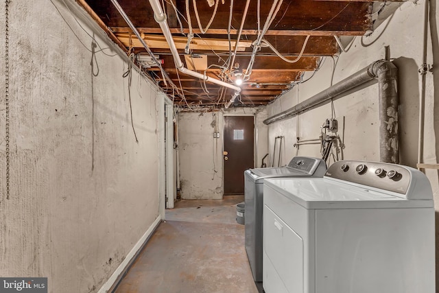 clothes washing area with washer and dryer and laundry area