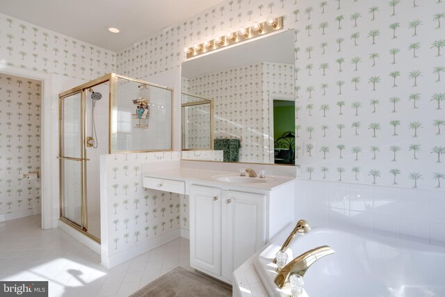 bathroom featuring a stall shower, a garden tub, and wallpapered walls