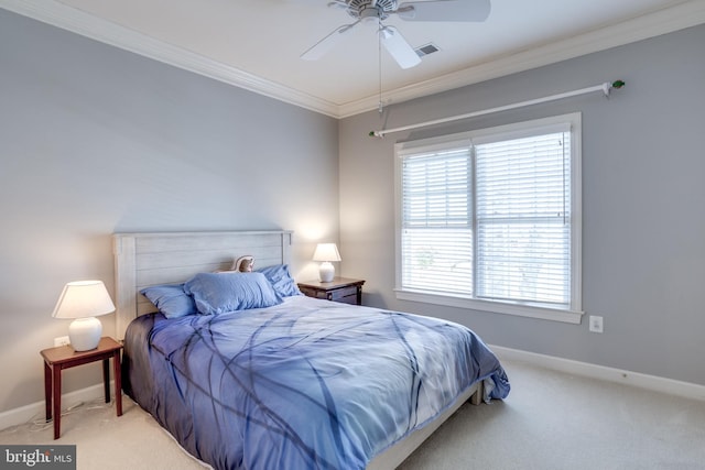 bedroom with baseboards, ceiling fan, carpet flooring, and crown molding