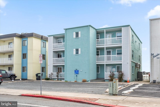 view of property featuring uncovered parking