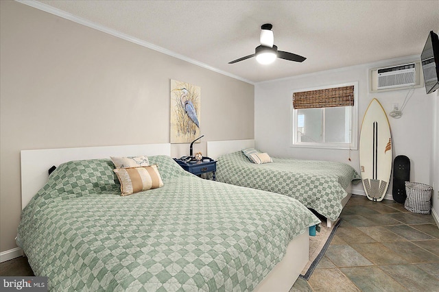 bedroom featuring a ceiling fan, crown molding, a textured ceiling, and baseboards