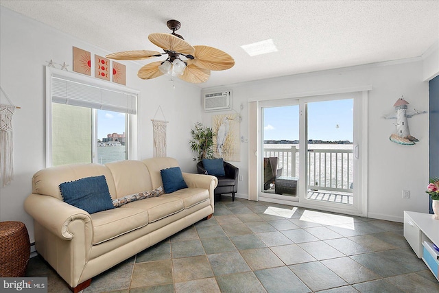 living area with a textured ceiling, a wealth of natural light, and a wall mounted AC