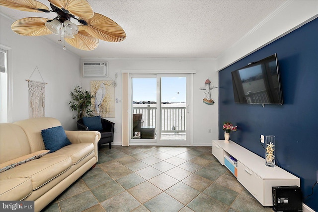 living room featuring a textured ceiling, a wall mounted air conditioner, a ceiling fan, and baseboards