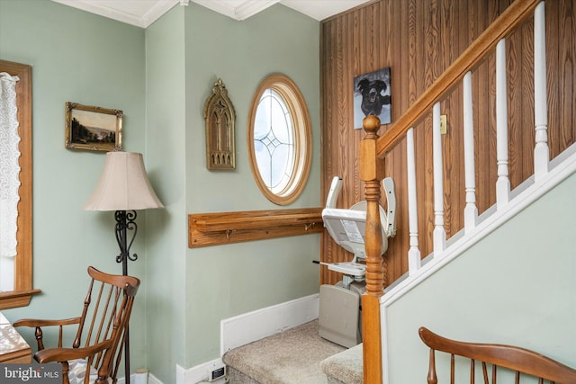 stairs with ornamental molding and baseboards