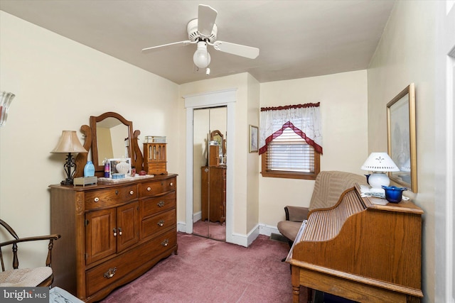 living area with carpet, baseboards, and ceiling fan