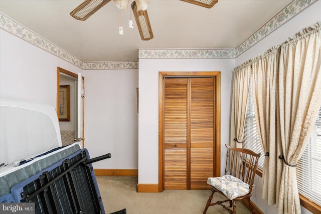 interior space featuring a ceiling fan and baseboards