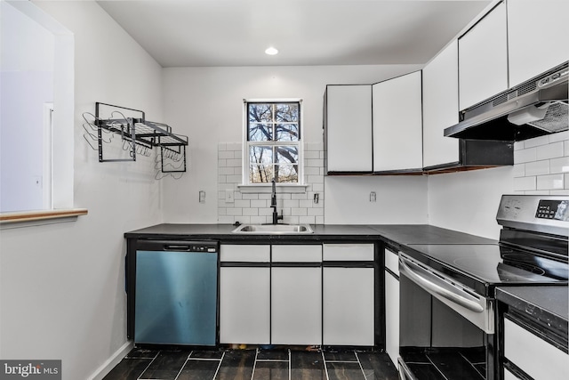 kitchen with dark countertops, dishwashing machine, stainless steel electric range, under cabinet range hood, and a sink