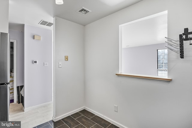 interior space with visible vents and baseboards