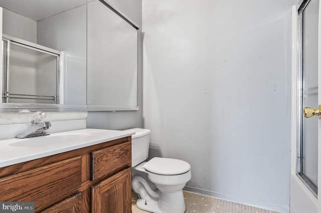 full bath featuring toilet, an enclosed shower, and vanity