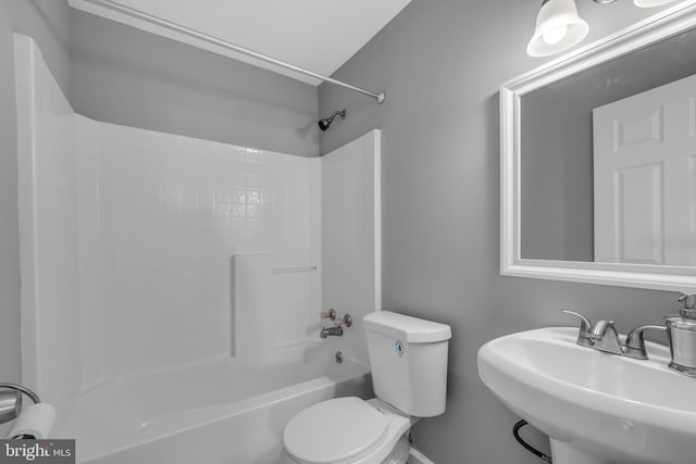 full bath featuring shower / tub combination, a sink, and toilet