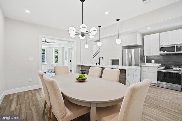 dining space featuring light wood-style floors, recessed lighting, and baseboards