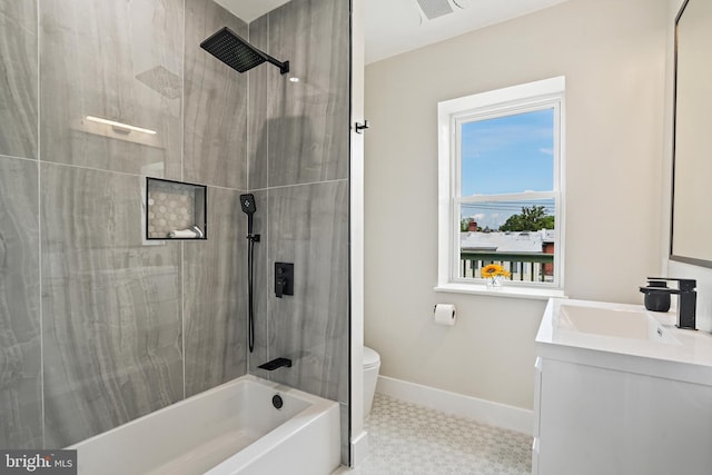 bathroom with visible vents, baseboards, toilet, tub / shower combination, and vanity