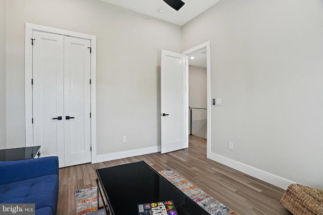 interior space featuring wood finished floors and baseboards