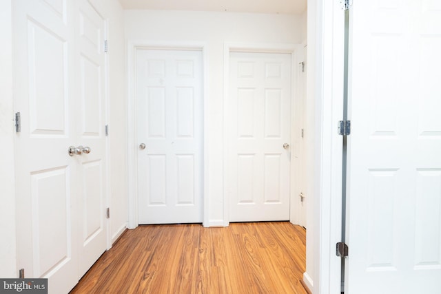 unfurnished bedroom featuring light wood-style flooring