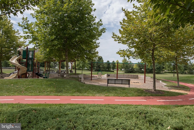 community play area featuring a lawn