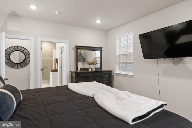 bedroom featuring visible vents, ensuite bathroom, and recessed lighting