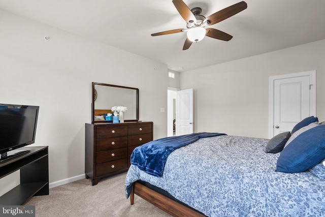 bedroom featuring a ceiling fan, carpet flooring, and baseboards