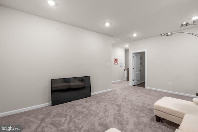 sitting room with carpet floors, recessed lighting, and baseboards