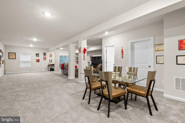 dining room featuring recessed lighting, baseboards, visible vents, and light colored carpet