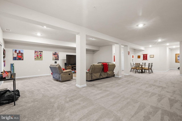 finished below grade area featuring carpet, visible vents, baseboards, and recessed lighting