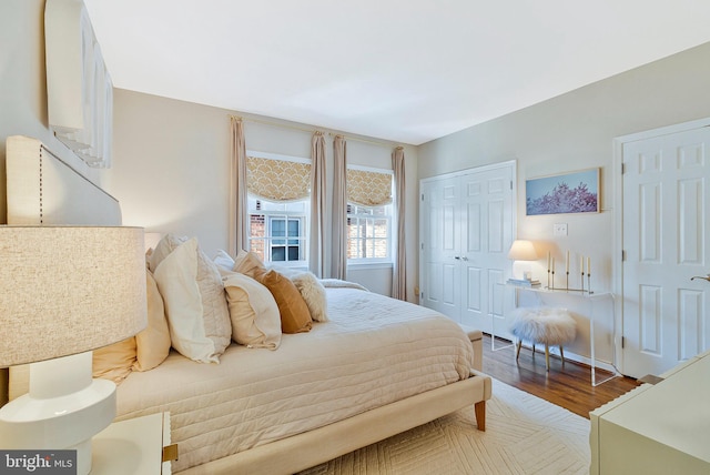 bedroom with a closet and wood finished floors