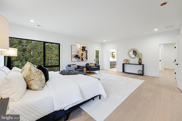 bedroom with light wood-style floors, multiple windows, visible vents, and recessed lighting