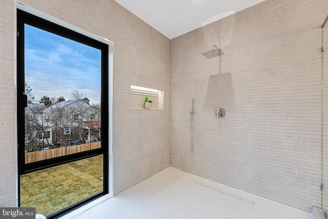 full bathroom featuring a tile shower