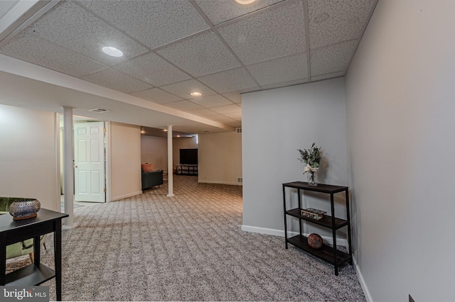 hall with a drop ceiling, recessed lighting, carpet floors, visible vents, and baseboards