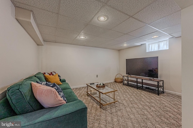 carpeted living area with recessed lighting, a drop ceiling, and baseboards