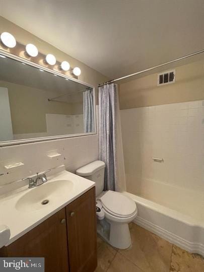 full bath featuring visible vents, toilet, shower / tub combo, vanity, and tile patterned flooring