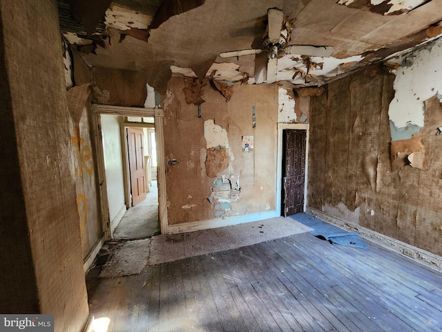 spare room featuring ceiling fan and hardwood / wood-style flooring