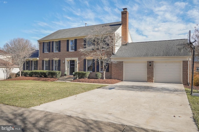 colonial home featuring a garage, driveway, a chimney, a front lawn, and brick siding