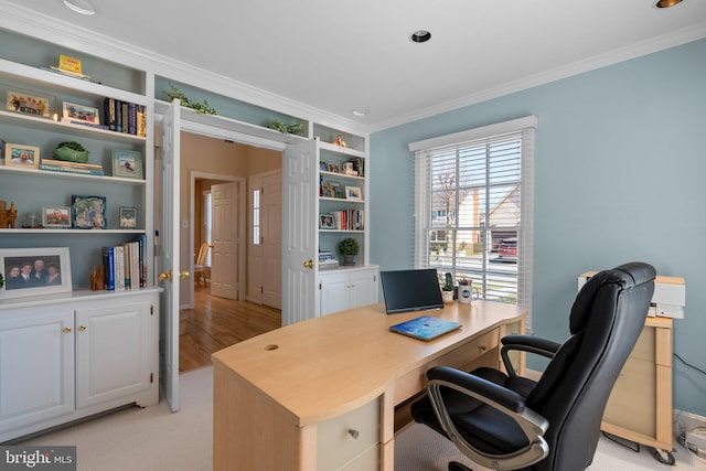 office featuring built in shelves and ornamental molding