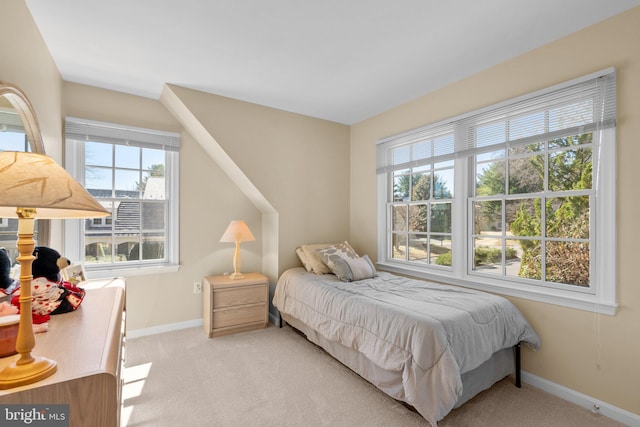 bedroom featuring carpet flooring and baseboards