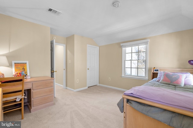 bedroom with lofted ceiling, baseboards, visible vents, and light carpet