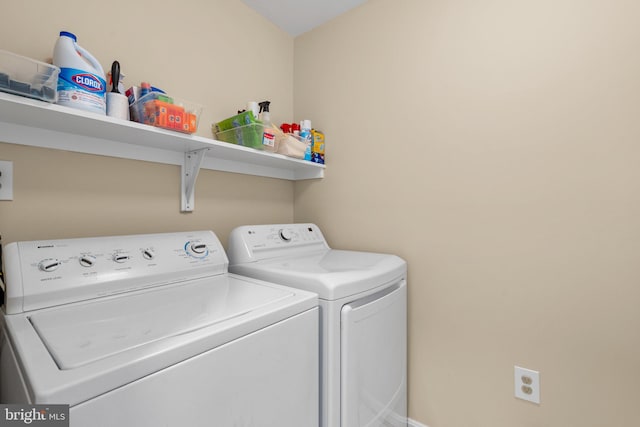 laundry area featuring laundry area and separate washer and dryer