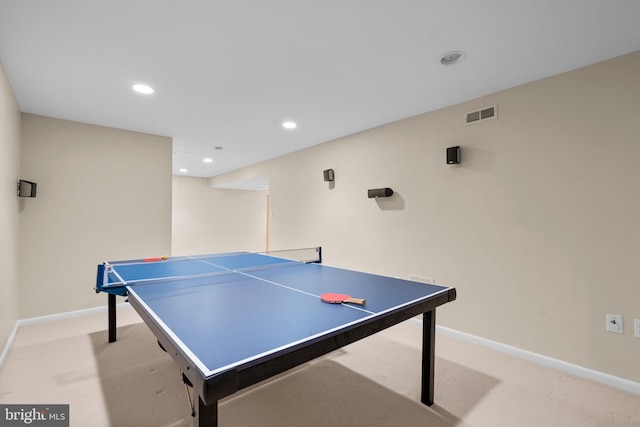 recreation room featuring visible vents, baseboards, and light colored carpet