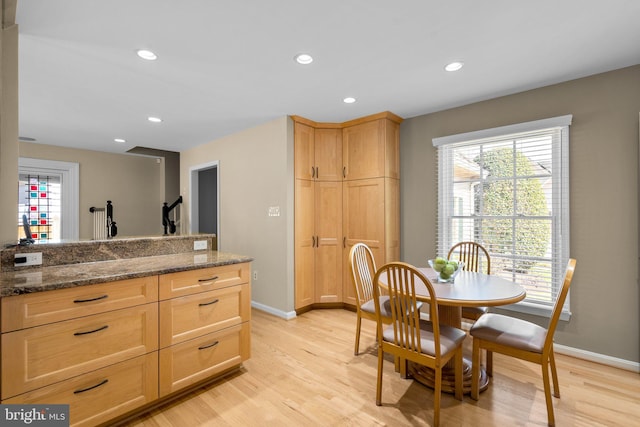 dining space with recessed lighting, baseboards, and light wood-style flooring