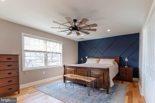 bedroom with ceiling fan, recessed lighting, light wood-style flooring, and baseboards