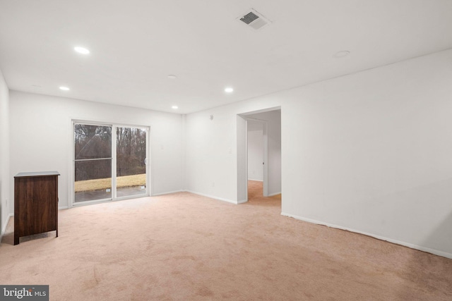 unfurnished room featuring baseboards, recessed lighting, visible vents, and light colored carpet