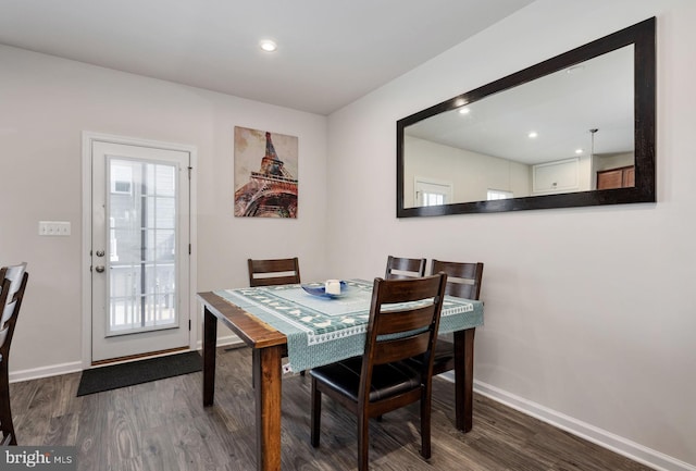 dining space featuring a healthy amount of sunlight, baseboards, and wood finished floors