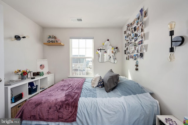 bedroom featuring visible vents