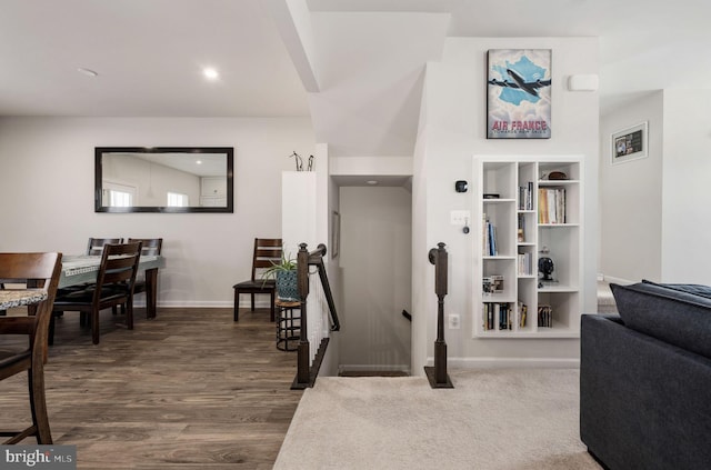 interior space with baseboards, dark wood-type flooring, and recessed lighting