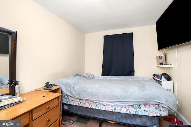 bedroom featuring baseboards