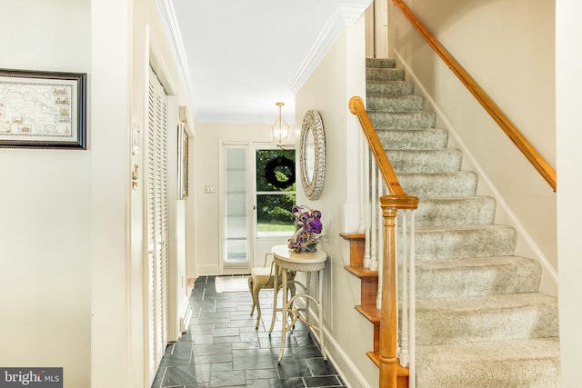 stairs with baseboards, crown molding, a chandelier, and stone tile flooring