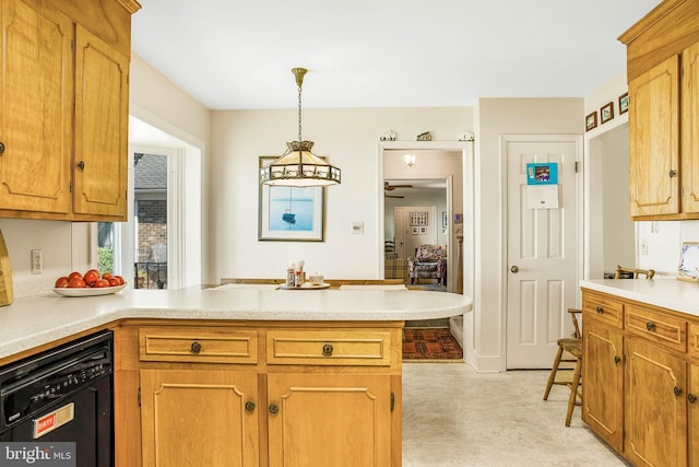 kitchen with dishwasher, brown cabinets, a peninsula, hanging light fixtures, and light countertops