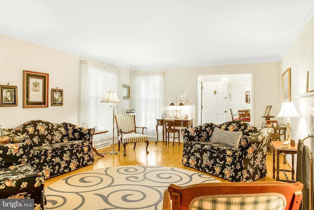 living room featuring wood finished floors and crown molding