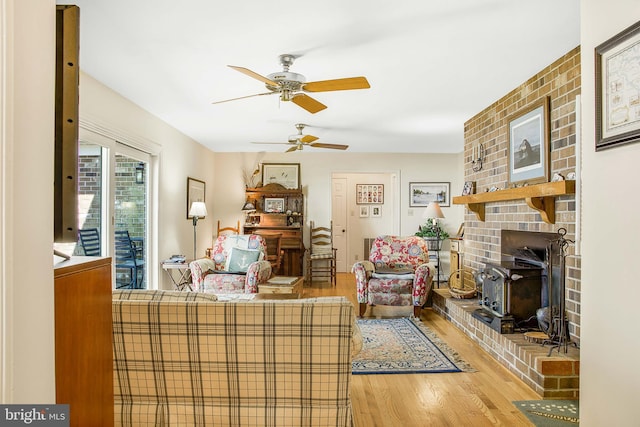 living area featuring a fireplace and wood finished floors